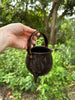 Black handmade ceramic cauldron with handle in copper lustre