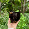 Black handmade ceramic cauldron with handles in copper lustre