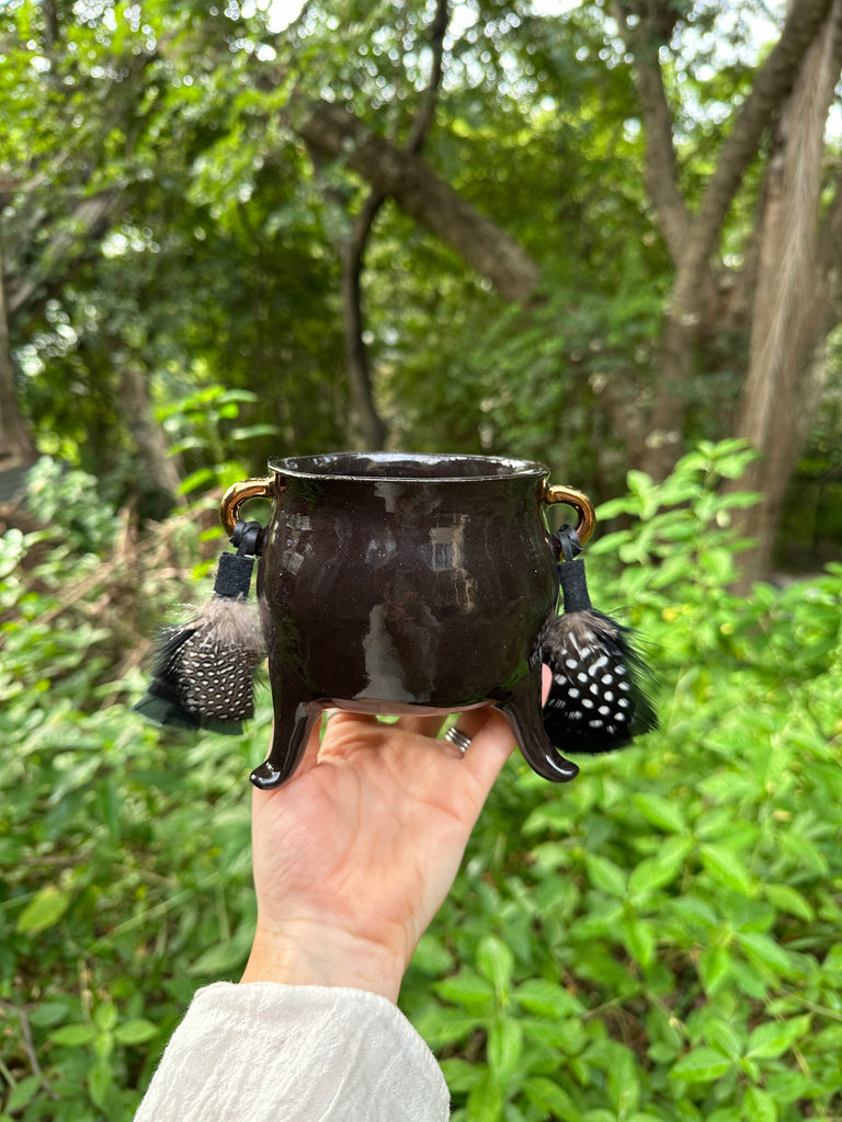 Black handmade ceramic cauldron with copper lustre